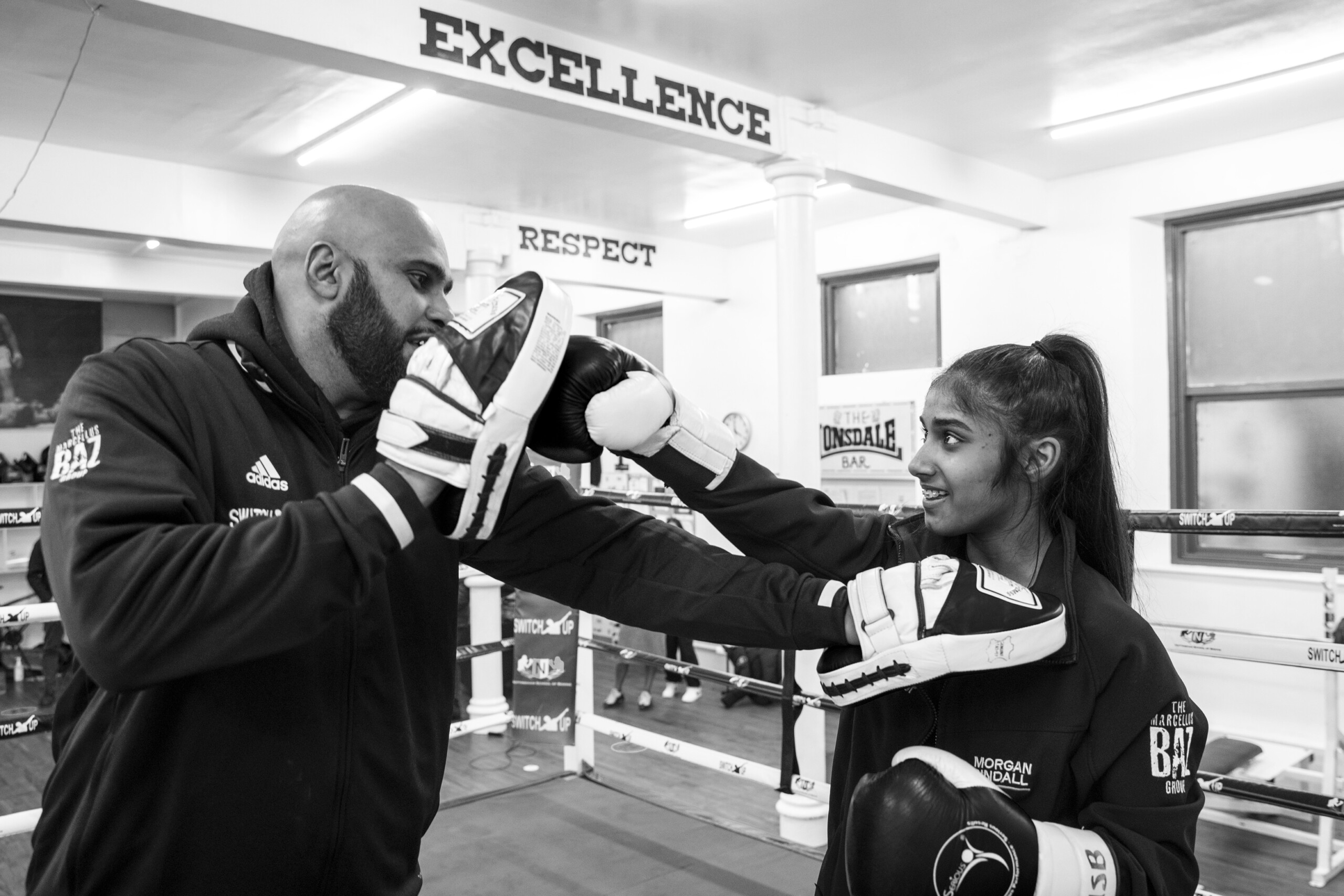 Safa in the ring with Baz for a boxing training session at Switch Up, Nottingham School of Boxing, Nottingham, United Kingdom. (photo by Andy Aitchison)