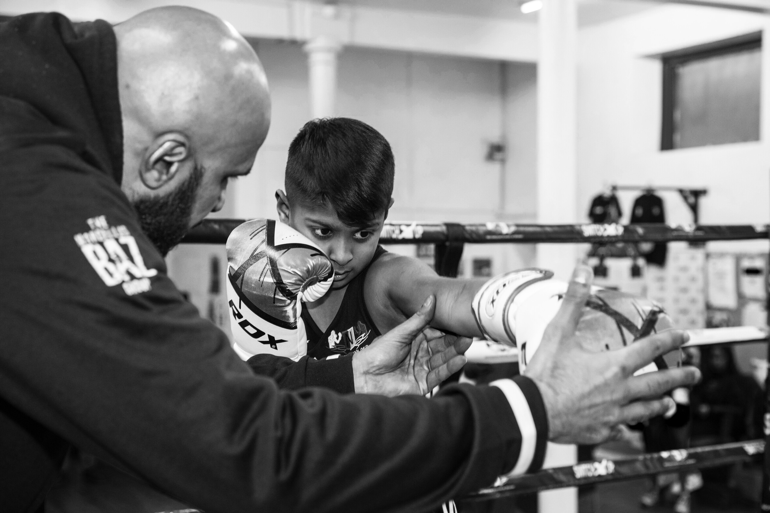 Adam in the ring with Baz for a boxing training session at Switch Up, Nottingham School of Boxing, Nottingham, United Kingdom. (photo by Andy Aitchison)